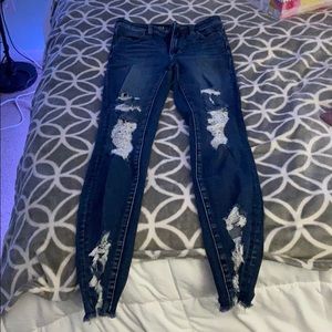 Distressed blue skinny jeans